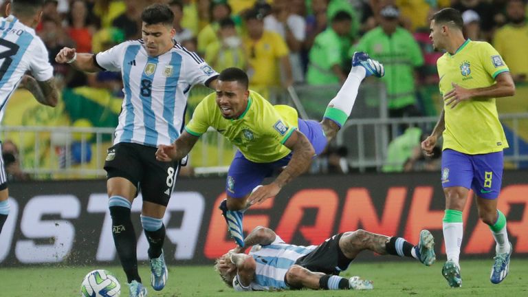 Brazil&#39;s Gabriel Jesus battles for the ball with Argentina&#39;s Marcos Acuna