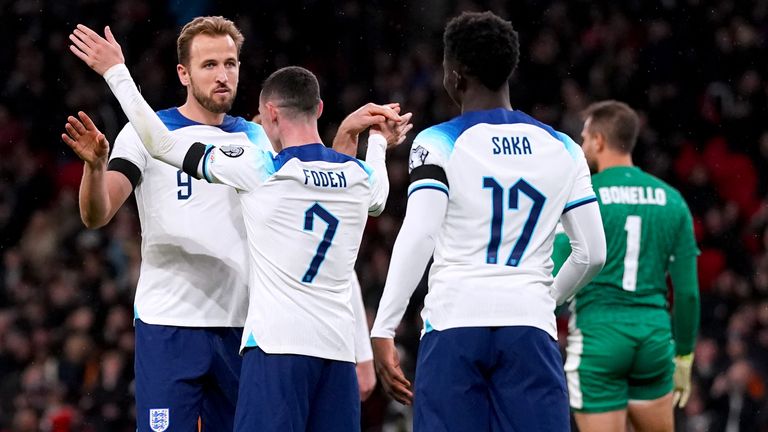 Harry Kane is congratulated by England team-mates after scoring the second against Malta