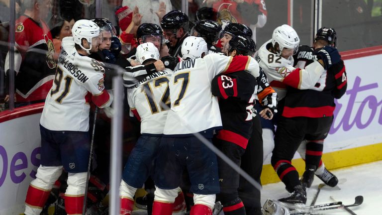 Players from the Ottawa Senators and the Florida Panthers fight during third-period NHL hockey game action in Ottawa, Ontario, Monday, Nov. 27, 2023. Every player on the ice was given a 10-minute penalty.