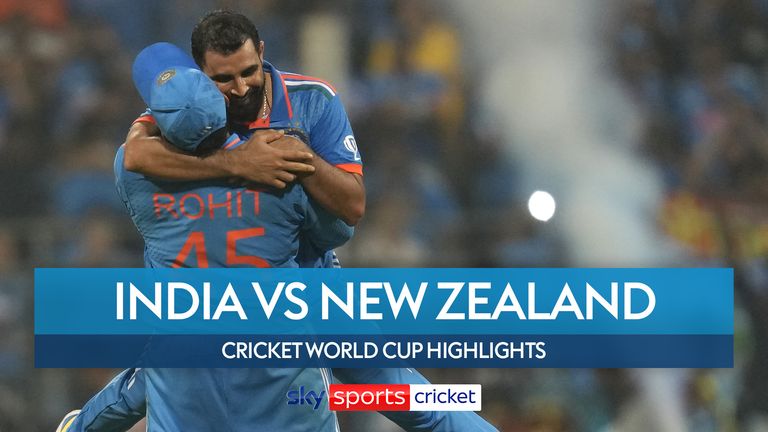 India&#39;s captain Rohit Sharma lifts Mohammed Shami after he took the last wicket and overall seven wickets to beat New Zealand by 70 runs during the ICC Men&#39;s Cricket World Cup first semifinal match in Mumbai, India, Wednesday, Nov. 15, 2023.