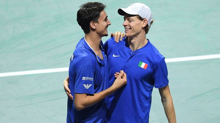 Italy's Jannik Sinner (R) and Lorenzo Sonego celebrate after winning against Serbia's Novak Djokovic and Momir Kecmanovic during the men's doubles semifinal tennis match between Italy and Serbia of the Davis Cup tennis tournament at the Martin Carpena sportshall, in Malaga on November 25, 2023. (Photo by JORGE GUERRERO / AFP) (Photo by JORGE GUERRERO/AFP via Getty Images)