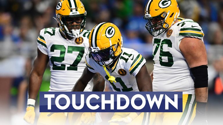 Green Bay Packers wide receiver Jayden Reed (11) reacts with teammates after hsi 10-yard reception for a touchdown during the first half of an NFL football game against the Detroit Lions, Thursday, Nov. 23, 2023, in Detroit. (AP Photo/David Dermer)