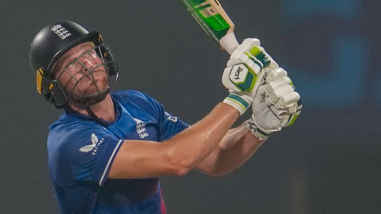 England's captain Jos Buttler, right, hits a six during the ICC Men's Cricket World Cup match between Pakistan and England in Kolkata, India, Saturday, Nov. 11, 2023. (AP Photo/Altaf Qadri)