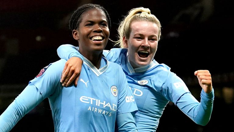 Khadija Shaw celebrates with Lauren Hemp after scoring Manchester City's third goal