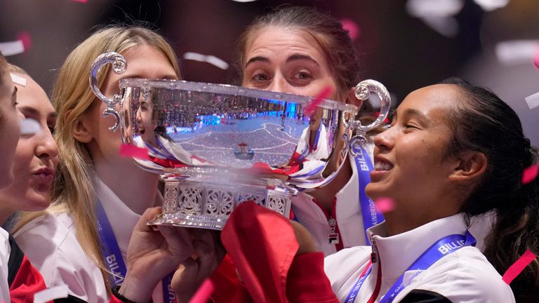 Canada's Leylah Fernandez, right, holds the trophy with member of her team after wining the final singles tennis match against Italy's Jasmine Paolini, during the Billie Jean King Cup finals in La Cartuja stadium in Seville, southern Spain, Spain, Sunday, Nov. 12, 2023. (AP Photo/Manu Fernandez)