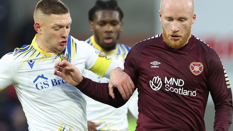 EDINBURGH, SCOTLAND - NOVEMBER 25: Hearts' Liam Boyce and St Johnstone's Liam Gordon in action during a cinch Premiership match between Heart of Midlothian and St Johnstone at Tynecastle Park, on November 25, 2023, in Edinburgh, Scotland. (Photo by Roddy Scott / SNS Group)
