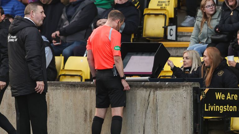 LIVINGSTON, SCOTLAND - OCTOBER 28: Referee Willie Collum gores to VAR before ruling out Amadou Bakayoko's goal for offside during a cinch Premiership match between Livingston and Dundee at the Tony Macaroni Arena, on October 28, 2023, in Livingston, Scotland.  (Photo by Ross MacDonald / SNS Group)