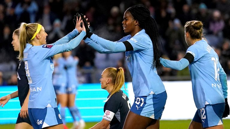 Manchester City's Khadija Shaw celebrates with team-mate Chloe Kelly after scoring against Tottenham