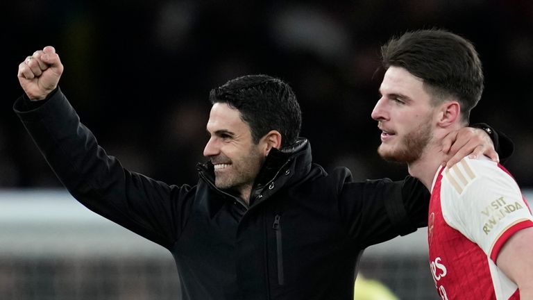 Arsenal's manager Mikel Arteta, left, and Declan Rice celebrate at the end of the English Premier League soccer match between Arsenal and Burnley at Emirates stadium in London, England, Saturday, Nov. 11, 2023. Arsenal won 3-1. (AP Photo/Kin Cheung)