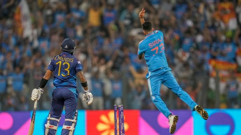 India&#39;s Mohammed Siraj celebrates the dismissal of Sri Lanka&#39;s captain Kusal Mendis, left during the ICC Men&#39;s Cricket World Cup match between India and Sri Lanka in Mumbai, India, Thursday, Nov. 2, 2023. (AP Photo/Rafiq Maqbool