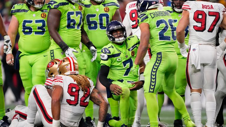 Seattle Seahawks quarterback Geno Smith (7) gets up after a sack during the second half against San Francisco 49ers
