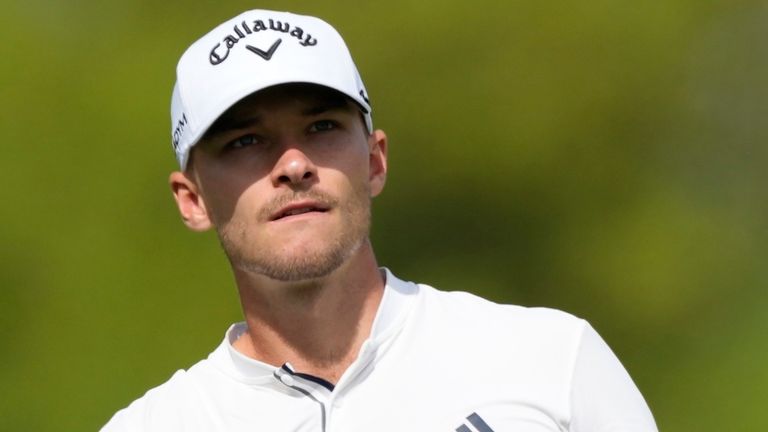 Nicolai Hojgaard of Denmark plays his second shot on the second hole during the round two of the DP World Tour Championship golf tournament, in Dubai, United Arab Emirates, Friday, Nov. 17, 2023. (AP Photo/Kamran Jebreili)