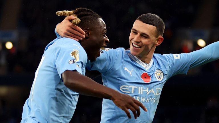 Phil Foden and Jeremy Doku celebrate Man City's fourth goal