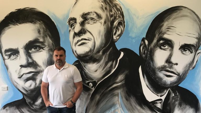 Ange Postecoglou poses in front of the mural, featuring himself, Johan Cruyff and Pep Guardiola (Pic courtesy of Nick Dimitrakis)