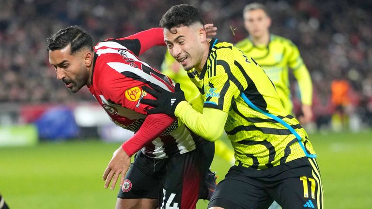 Saman Ghoddos and Gabriel Martinelli duel for possession