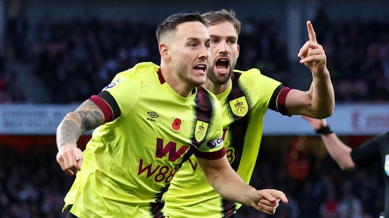 Josh Brownhill wheels away in celebration after equalising for Burnley at the Emirates