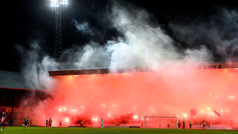 DUNDEE, SCOTLAND - NOVEMBER 01: Smoke from Rangers fan pyro clears during a cinch Premiership match between Dundee FC and Rangers at The Scot Foam Stadium at Dens Park, on November 01, 2023, in Dundee, Scotland.  (Photo by Rob Casey / SNS Group)