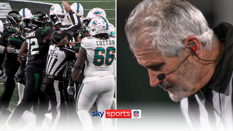A match official was seen to spit blood after being hit in the mouth when attempting to split up a brawl between the Dolphins and the Jets