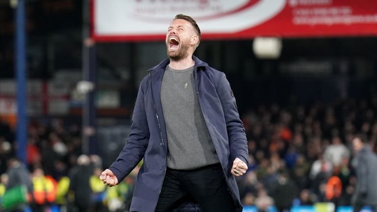 Rob Edwards beams and celebrates at full-time