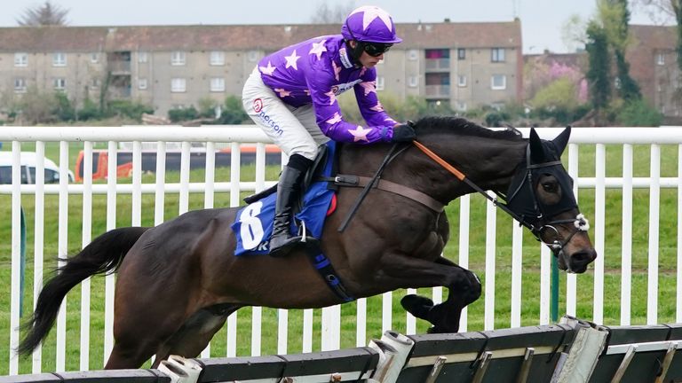 Rubaud ridden by jockey Harry Cobden on their way to winning the Coral Scottish Champion Hurdle
