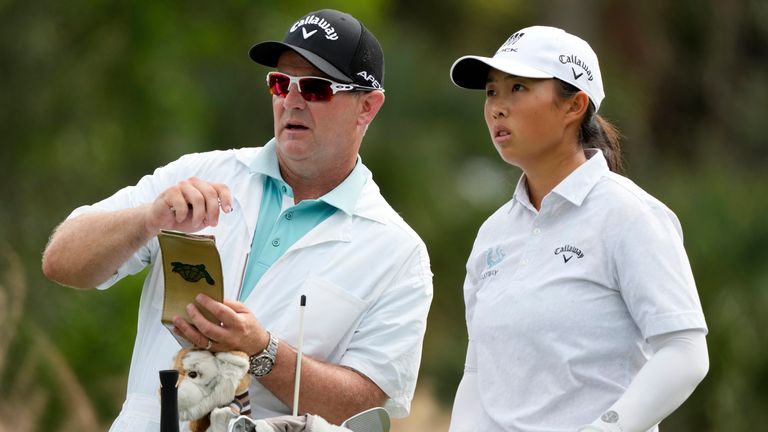 Ruoning Yin talks with her caddie David Jones during the first round of the CME Group Tour Championship