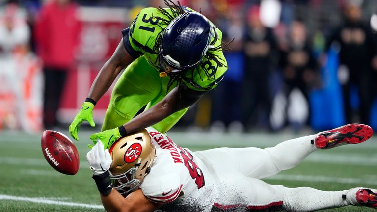 San Francisco 49ers tight end Charlie Woerner (89) attempts to recover the punt return fumble by Seattle Seahawks' DeeJay Dallas (31) during the first half