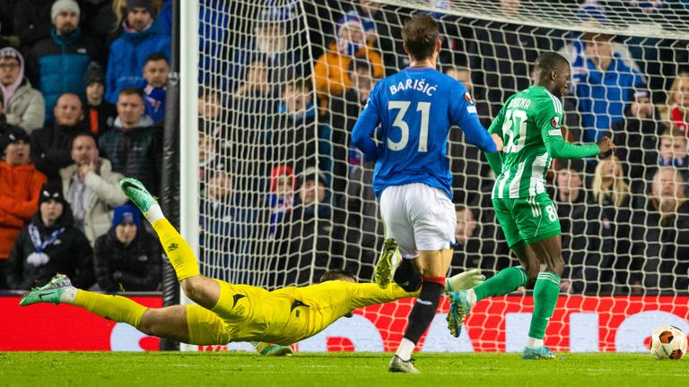 GLASGOW, SCOTLAND - NOVEMBER 30: Aris Limassol's Shavy Babicka takes the ball past Rangers' Jack Butland as he scores to make it 1-0  during a UEFA Europa League group stage match between Rangers and Aris Limassol at Ibrox Stadium, on November 30, 2023, in Glasgow, Scotland. (Photo by Alan Harvey / SNS Group)