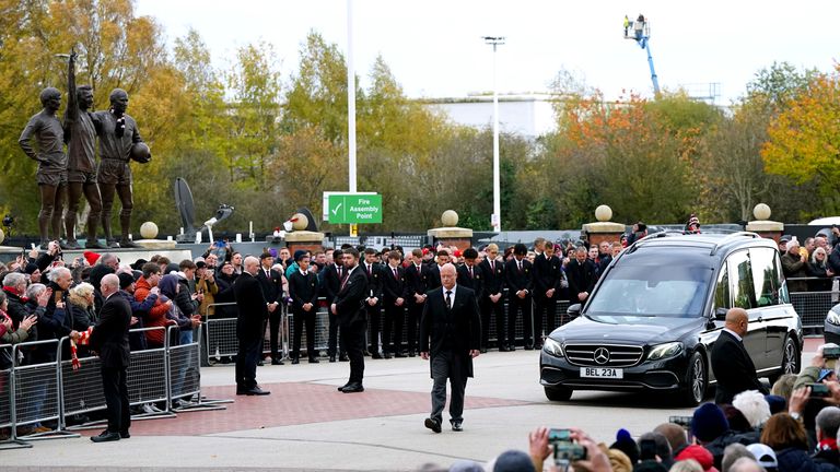 The funeral procession of Sir Bobby Charlton passes Old Trafford