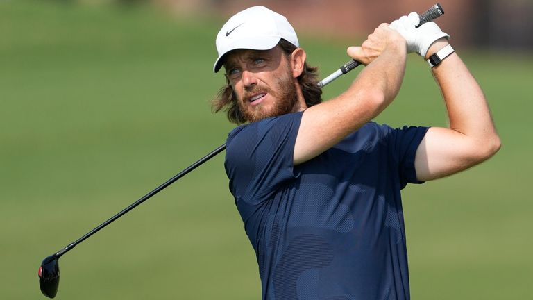 England's Tommy Fleetwood plays his second shot on the second hole during the final round of the DP World Tour Championship golf tournament, in Dubai, United Arab Emirates, Sunday, Nov. 19, 2023. (AP Photo/Kamran Jebreili)