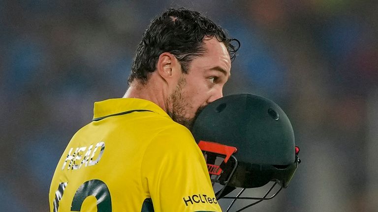 Australia&#39;s Travis Head kisses his helmet to celebrate scoring a century during the Men&#39;s Cricket World Cup final (Associated Press)