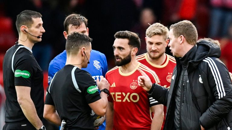 ABERDEEN, SCOTLAND - NOVEMBER 26: Aberdeen's Graeme Shinnie speaks with Referee Nick Walsh at full time during a cinch Premiership match between Aberdeen and Rangers at Pittodrie Stadium, on November 26, 2023, in Aberdeen, Scotland. (Photo by Rob Casey / SNS Group)