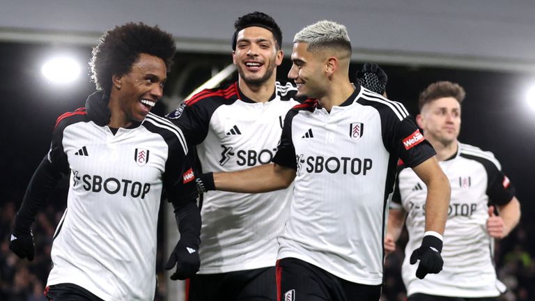 Willian celebrates with Fulham team-mates after his penalty against Wolves