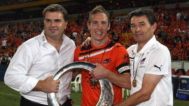 Postecoglou (L) and Matt Smith celebrate their Grand Final victory in 2012
