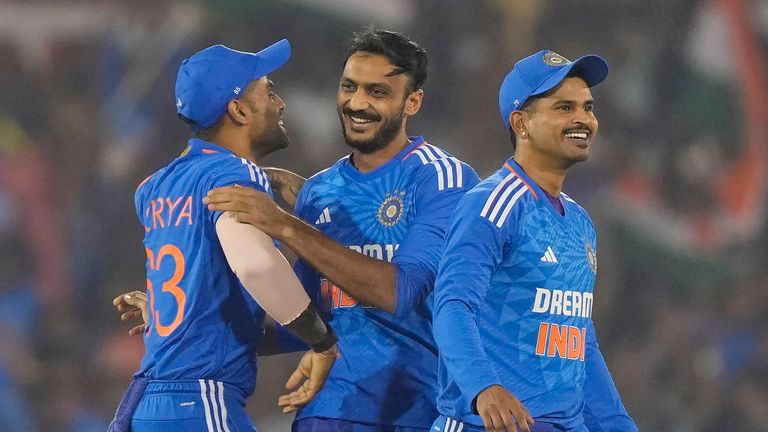 India's Axar Patel celebrates the dismissal of Australia's Aaron Hardie with India's captain Suryakumar Yadav 