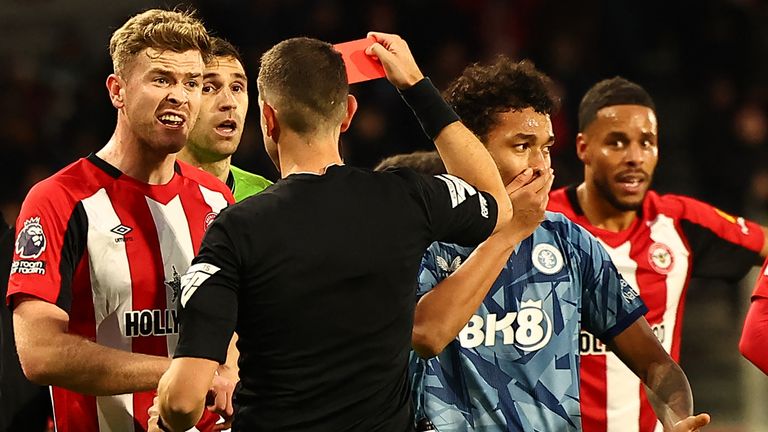 Aston Villa's Boubacar Kamara is shown a red card by referee David Coote