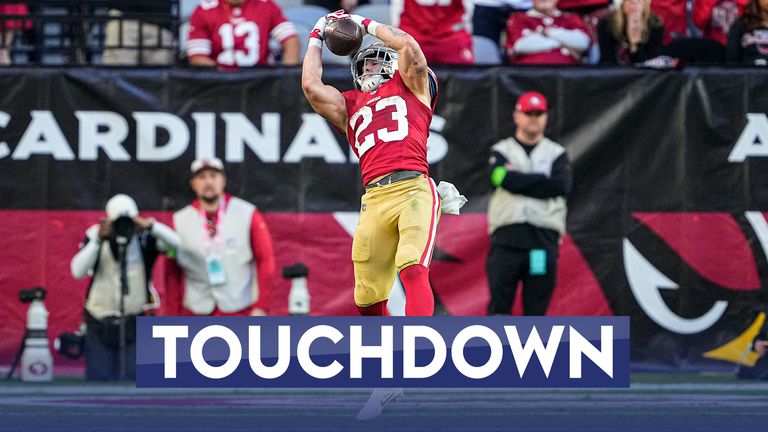San Francisco 49ers running back Christian McCaffrey catches a touchdown pass during the second half of an NFL football game against the Arizona Cardinals
