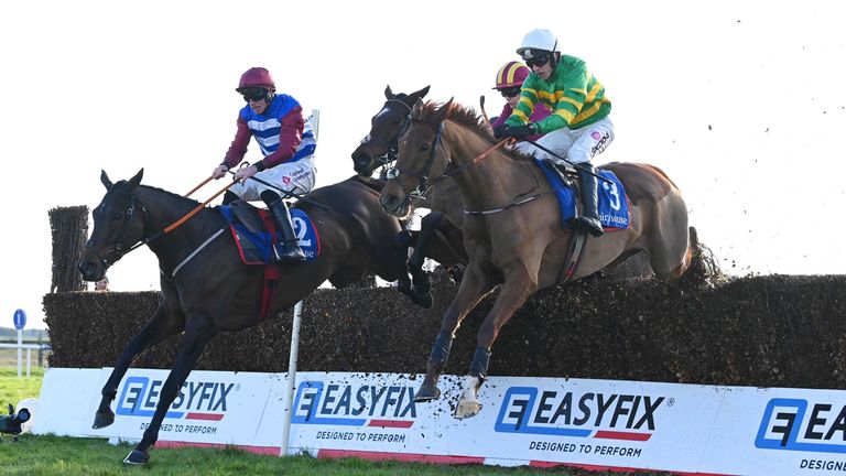 Corbetts Cross and Mark Walsh (white cap) win the Jim Ryan Beginners Chase from Three Card Brag at Fairyhouse