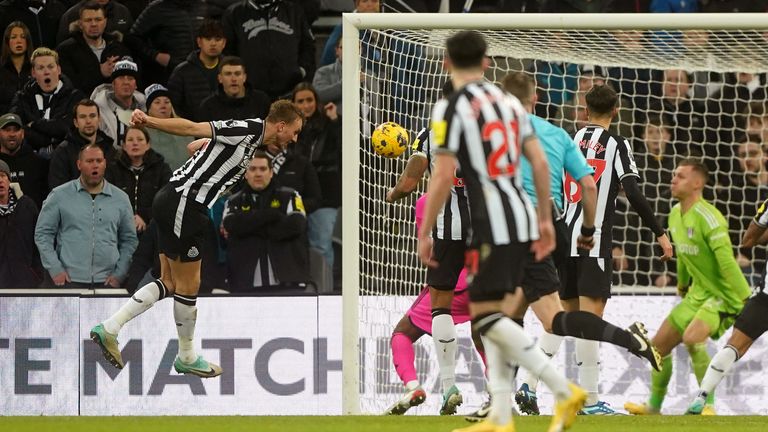 Dan Burn heads in Newcastle's third goal of the game