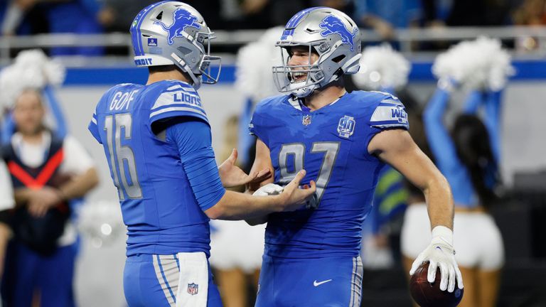 Detroit Lions quarterback Jared Goff (16) greets tight end Sam LaPorta (87) after LaPorta&#39;s 10-yard reception for a touchdown during the second half against the Denver Broncos – the pair connected three times for TDs during the rout (AP Photo/Duane Burleson)
