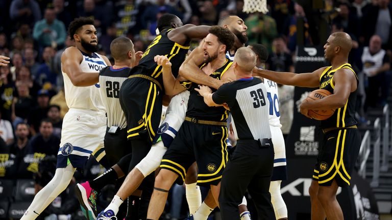  Draymond Green, left, gets into an altercation with Minnesota Timberwolves center Rudy Gobert, back, during the first half of an in-season NBA tournament basketball game in San Francisco, Nov. 14, 2023. Green has been suspended indefinitely by the NBA on Wednesday, Dec. 13. (AP Photo/Jed Jacobsohn, File)