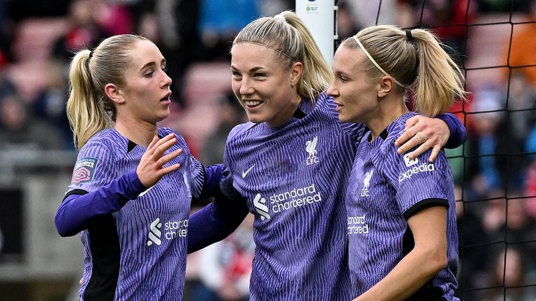 Emma Koivisto, Missy Bo Kearns and Sophie Roman Haug celebrate Liverpool's equaliser, an own goal scored by Millie Turner