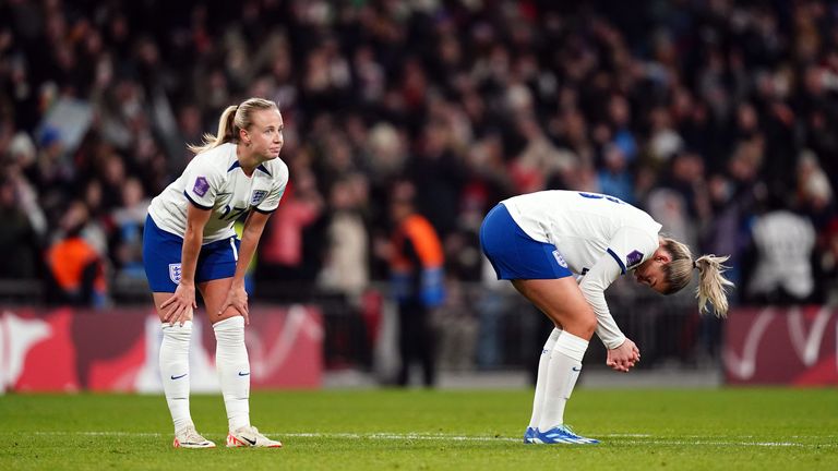 Beth Mead (right) looks dejected at full-time after making her first England appearance in a year