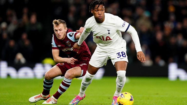 Tottenham Hotspur's Destiny Udogie battles for the ball with West Ham United's James Ward-Prowse