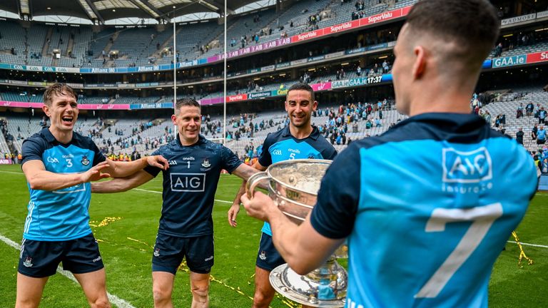 Dublin , Ireland - 30 July 2023; Dublin players and record 9 time All-Ireland winning medallists, from left, captain James McCarthy, Stephen Cluxton and Michael Fitzsimons celebrate with teammate Lee Gannon, right, and the Sam Maguire Cup after the GAA Football All-Ireland Senior Championship final