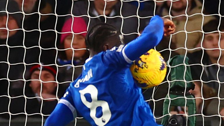 LIVERPOOL, ENGLAND - DECEMBER 27: Amadou Onana of Everton blocks the shot of Nathan Ake of Manchester City with his arm and a penalty is subsequently awarded during the Premier League match between Everton FC and Manchester City at Goodison Park on December 27, 2023 in Liverpool, England. (Photo by Chris Brunskill/Fantasista/Getty Images)