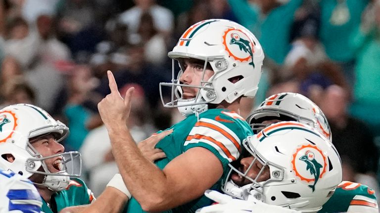 Miami Dolphins place kicker Jason Sanders, center, celebrates after kicking the game winning field goal during the second half of an NFL football game against the Dallas Cowboys, Sunday, Dec. 24, 2023, in Miami Gardens, Fla. (AP Photo/Rebecca Blackwell)