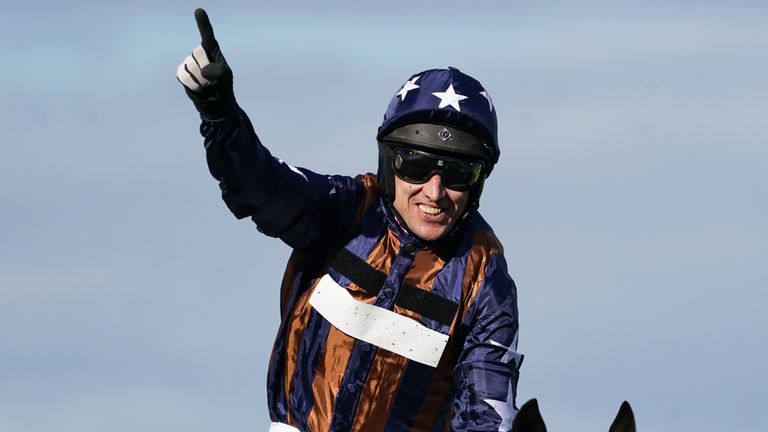 Paddy Brennan celebrates after winning at Aintree on Dysart Enos