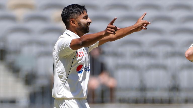 Khurram Shahzad, left, of Pakistan celebrates after taking the wicket of Australia's Steve Smith on the fourth day of the first test in Perth (Richard Wainwright/AAP Image via AP)