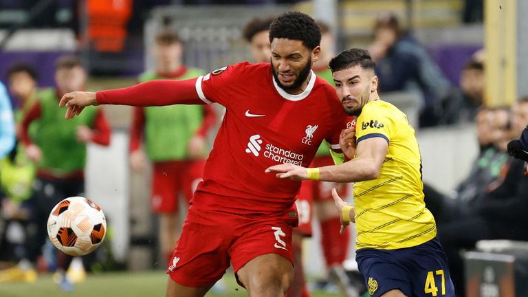 Liverpool's Joe Gomez, left, battles for the ball with Union SG's Mohamed Amoura 