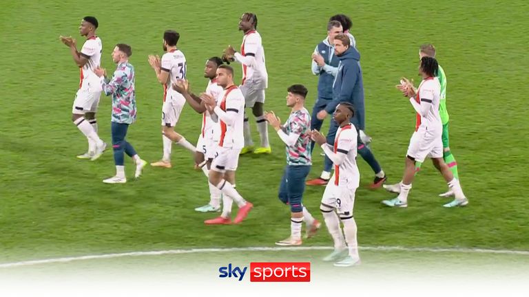 Luton players applaud the fans after their game with Bournemouth was abandoned.